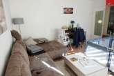 Whg. 1 Wohnzimmer - Attraktive Kapitalanlage: Vierparteienhaus in begehrter, stadtnaher Lage von Aurich!