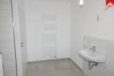 Badezimmer Bild III - Moderne Erdgeschosswohnung mit drei Zimmern in Esens. Neubau- Erstbezug!