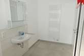 Badezimmer - Wunderschöne helle Obergeschosswohnung in Esens. Neubau Erstbezug!