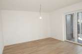 Wohn-und Essbereich Bild III - Helle Erdgeschosswohnung mit Terrasse in Wiesmoor – Neubau- Erstbezug!