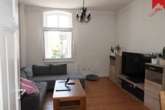 gemütliches Wohnzimmer - Stilvolle, gemütliche Obergeschosswohnung in zentraler Lage von Aurich!