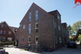 Rückansicht - Neubau- Erdgeschosswohnung mit 3 Zimmern in Küstennähe. Optimal als Kapitalanlage oder zur Eigennutzung.