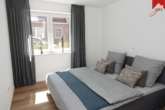 Schlafzimmer - Neubau- Erdgeschosswohnung mit 3 Zimmern in Küstennähe. Optimal als Kapitalanlage oder zur Eigennutzung.