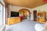Wohnzimmer mit Rundbogen zum Kaminzimmer - Perfekt für die Familie! Gepflegtes Einfamilienhaus im Herzen von Westerholt!
