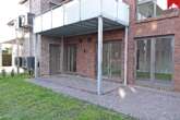 Terrasse mit Zugang zu externen Abstellraum - Attraktive Erdgeschosswohnung im schönen Neubau und zentraler Lage von Wiesmoor!