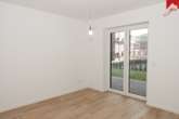 Schlafzimmer - Attraktive Erdgeschosswohnung im schönen Neubau und zentraler Lage von Wiesmoor!