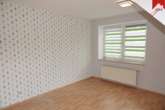 Wohn- und Esszimmer Bild III - Drei-Zimmer Obergeschosswohnung mit sonnigem Balkon mitten in Aurich!