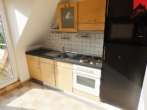 Küche mit EBK - Drei-Zimmer Obergeschosswohnung mit sonnigem Balkon mitten in Aurich!
