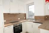 Einbauküche Bild II - Neubau- Erstbezug! Ansprechende 3-Zimmer-Obergeschosswohnung mit Einbauküche am Stadtrand von Esens!