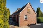 Außenansicht des Erweiterungsbaus - Gepflegtes Einfamilienhaus mit einem Erweiterungsbau und viel Potenzial in eingewachsener Siedlungslage von Utarp